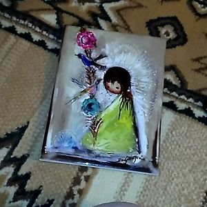 Degrazia painted on frame art work